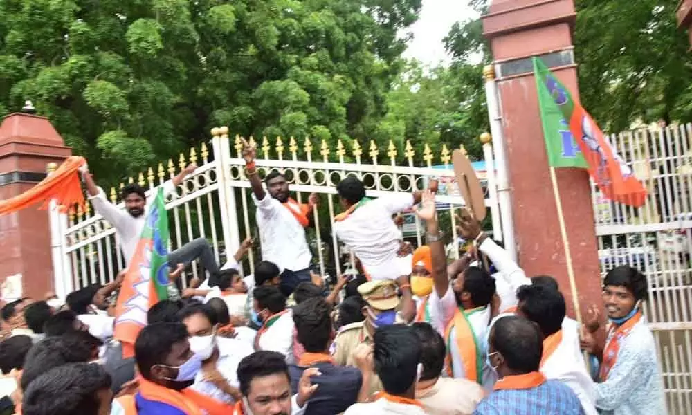 BJYM activists laying siege to collectors office in Karimnagar on Tuesday.
