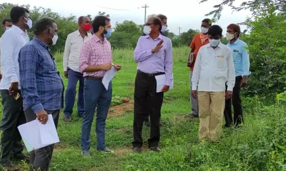 District officials doing a field survey in Vasalamarri village on Tuesday