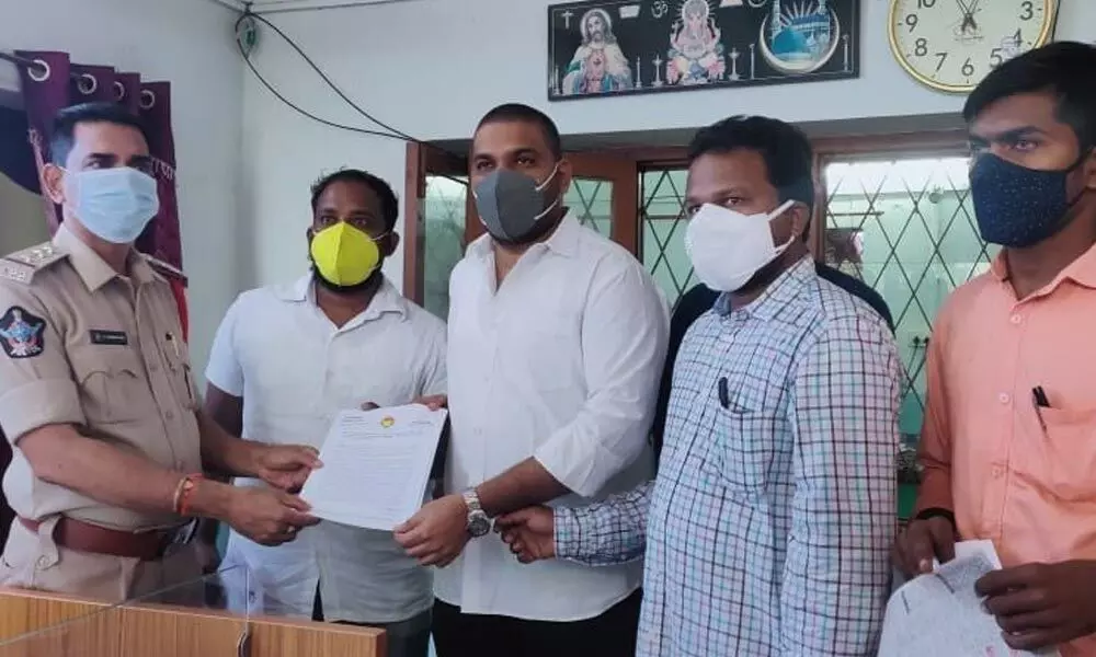 TNSF state president MV Pranav Gopal and other student leaders filing a complaint against AU VC at the police station on Tuesday in Visakhapatnam