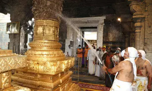 TTD EO K S Jawahar Reddy and other staff cleanse as part of Koil Alwar Tirumanjanam at Tirumala on Tuesday
