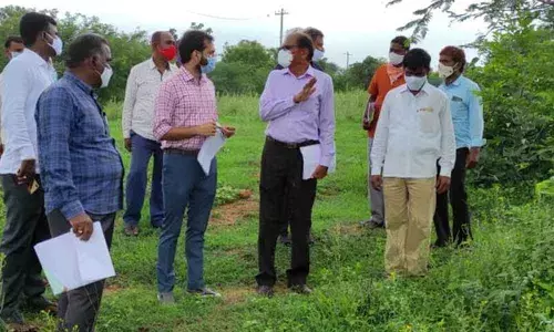 District officials doing a field survey in Vasalamarri village on Tuesday