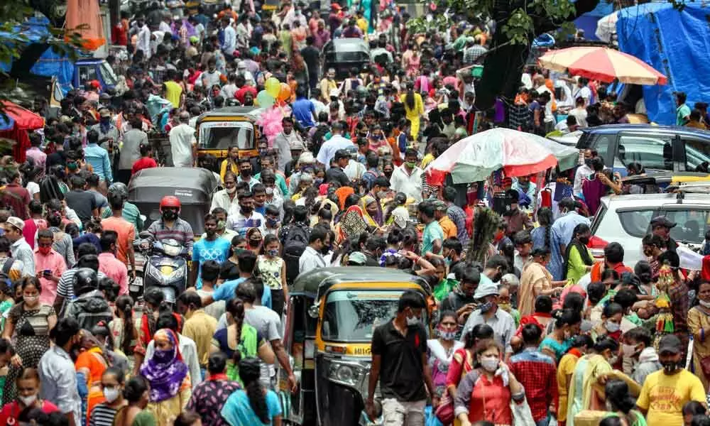 A crowded market after the relaxation of Covid-induced lockdown restrictions, in Mumbai on Wednesday