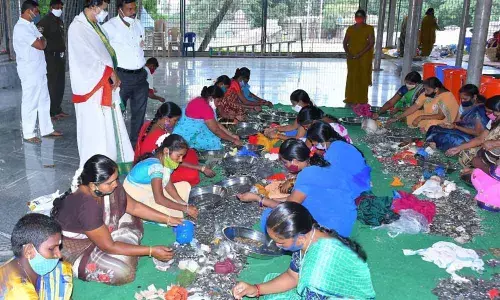Temple Executive Officer K S Rama Rao inspecting the counting of hundi collections at Srisailam temple on Wednesday