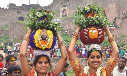 Woman carrying Bonalu