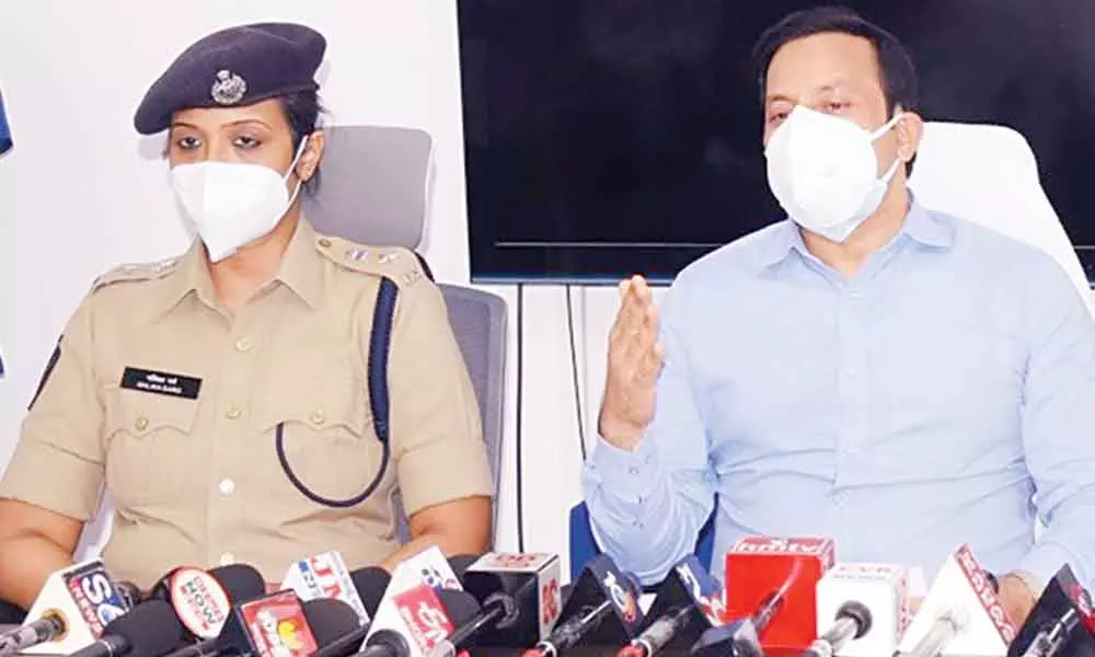 Collector Pravin Kumar and SP Malika Garg speaking at a press meet in Ongole on Thursday