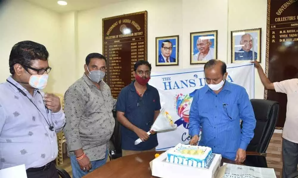 Collector M Hari Jawaharlal cutting a cake on the occasion of the 10th anniversary celebrations of The Hans India at the Collectorate in Vizianagaram on Friday