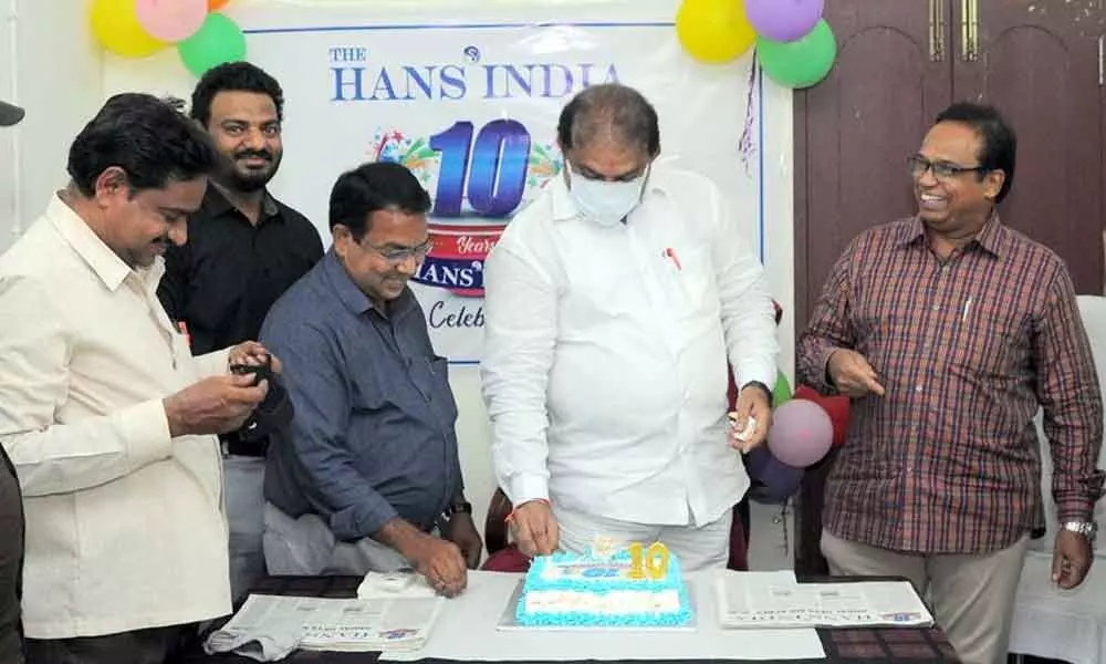 MLA Malladi Vishnu cutting cake at 10th anniversary celebrations of ‘The Hans India’ in Vijayawada on Friday