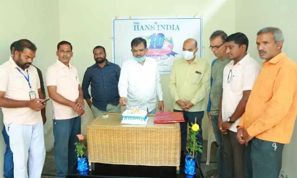 Additional Collector Vanamala Chandrashekar and DPRO Peddi Srinivas unveiling decennial edition of The Hans India on its 10th anniversary