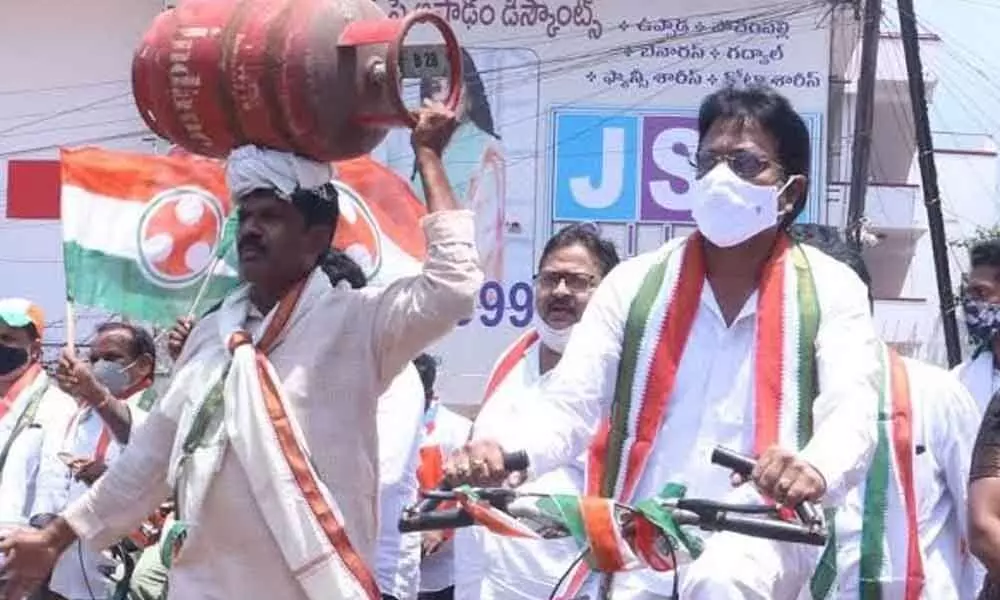 Congress leaders staging a novel protest in Visakhapatnam on Saturday
