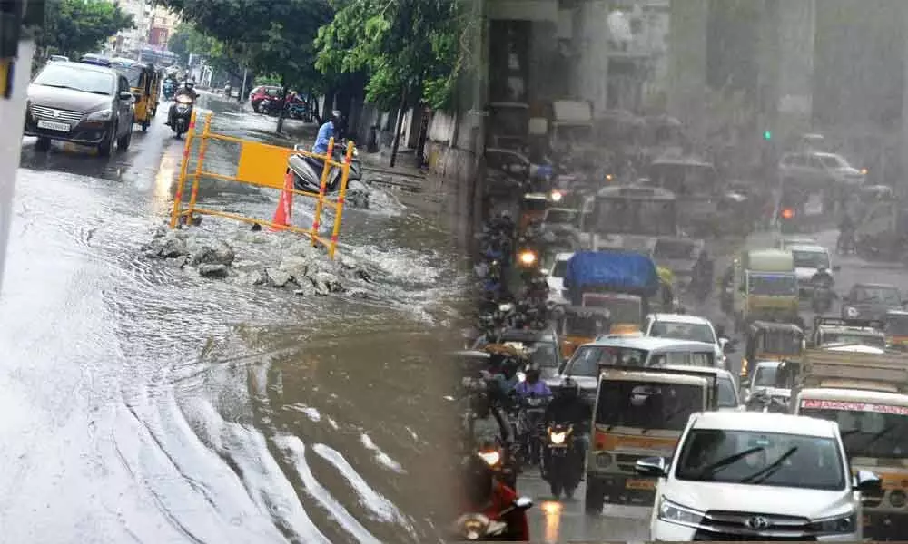 Rains across the city threw vehicular traffic out of gear and resulted in stagnant pools of water on many arteries on Sunday.  	Photos: Srinivas Setty
