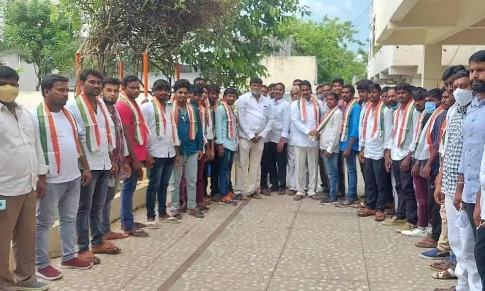 TPCC State secretary Patel Ramesh Reddy inviting TRS youth into the party fold by offering party kanduva at a programme at his hosue in Suryapet on Sunday