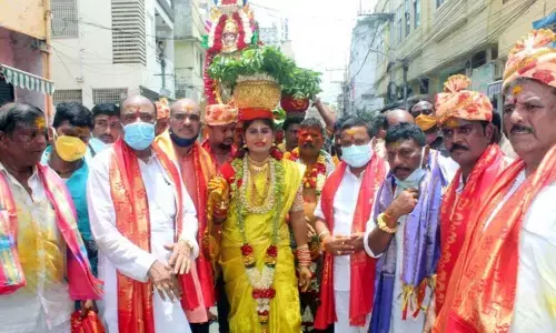 Members of Bhagyanagar Utsava Committee on the way to Sri Kanaka Durga temple in Vijayawada on Sunday