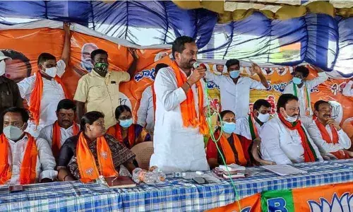 Dubbaka MLA M Raghunandan Rao addressing a meeting at Kamalapur in Warangal Urban district on Sunday