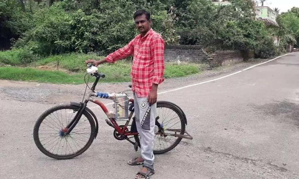 S Baskaran with his electric cycle