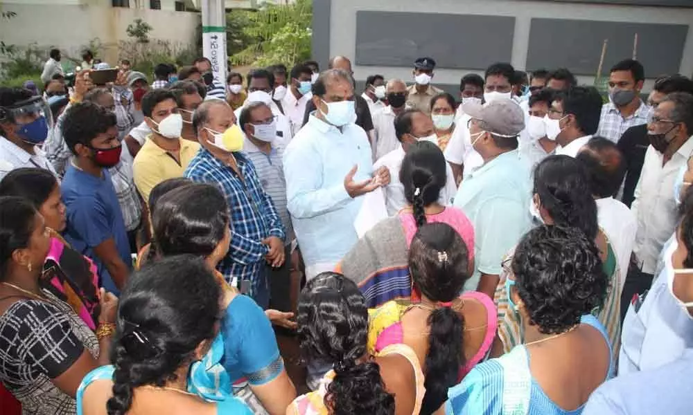 MLA Malladi Vishnu speaks to the residents of Nandamuri Nagar in 58 division in Vijayawada on Monday