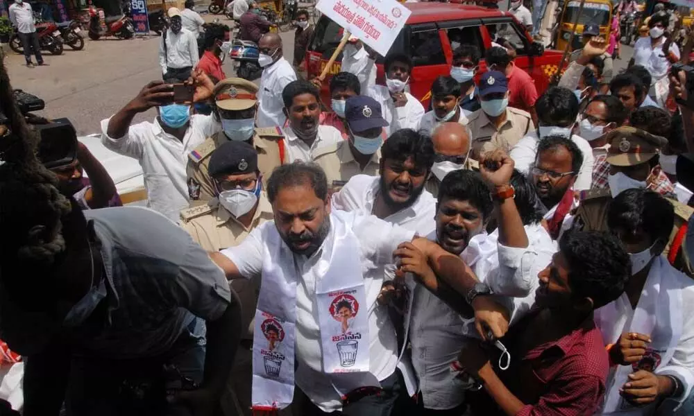 Police shifting the Janasena workers conducting a protest rally to employment office in Ongole on Tuesday