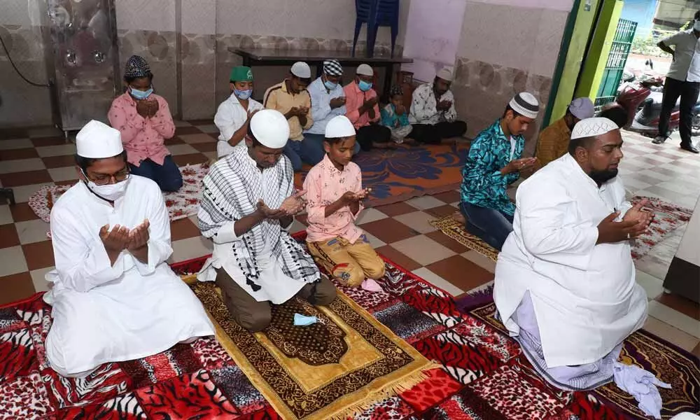 Muslims offer prayers on the occasion of Bakrid at  their homes due to Covid-19 restrictions on Wednesday