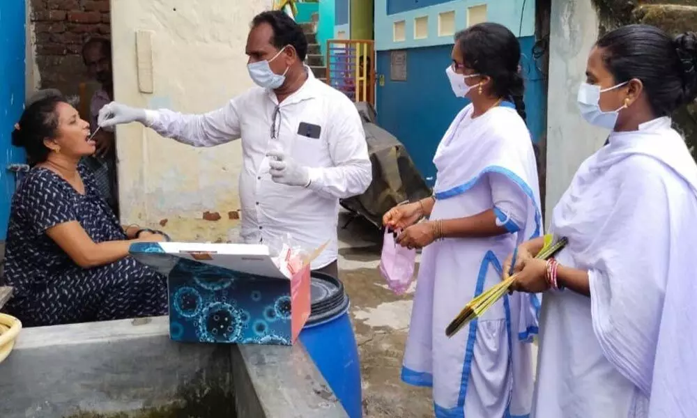 Health staff conducting Covid tests in Srikakulam city on Wednesday