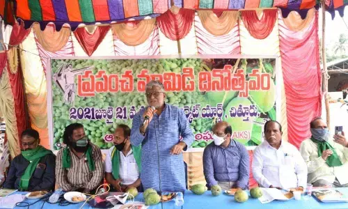 AP Rythu Sangham general secretary K V Prasad addressing a symposium organised to mark the World Mango Day at Market Yard in Chittoor on Wednesday