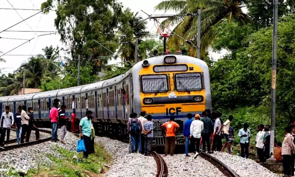 Passengers alight at the accident spot where the Mysuru-KSR Bengaluru MEMU Passenger Train