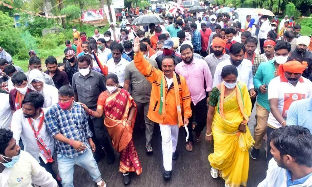 BJP leader Eatala Rajender greeting people during his padayatra in Vavilala village of Jammikunta mandal in Karimnagar on Thursday