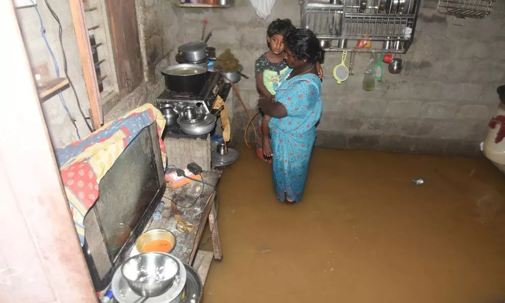 Rainwater inundates a house at Deendayal Nagar in Hanamkonda on Thursday 	Photo: G Shyam Kumar
