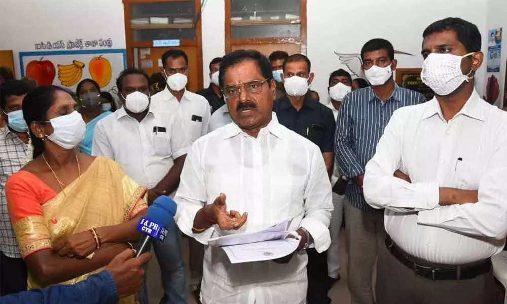 Deputy Chief Minister K Narayana Swamy  addressing media at the Collectorate in Chittoor on Thursday. District Collector M Hari Narayanan and Mayor N Amuda are also seen.