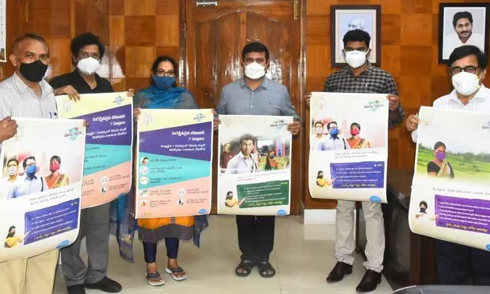 District Collector  V Vinay Chand, Municipal Commissioner  G Srijana,  AMC Principal  P V Sudhakar and DMHO P S Surya Narayana, among others, release posters of the Covid-appropriate behaviour awareness drive  on Thursday  in Visakhapatnam