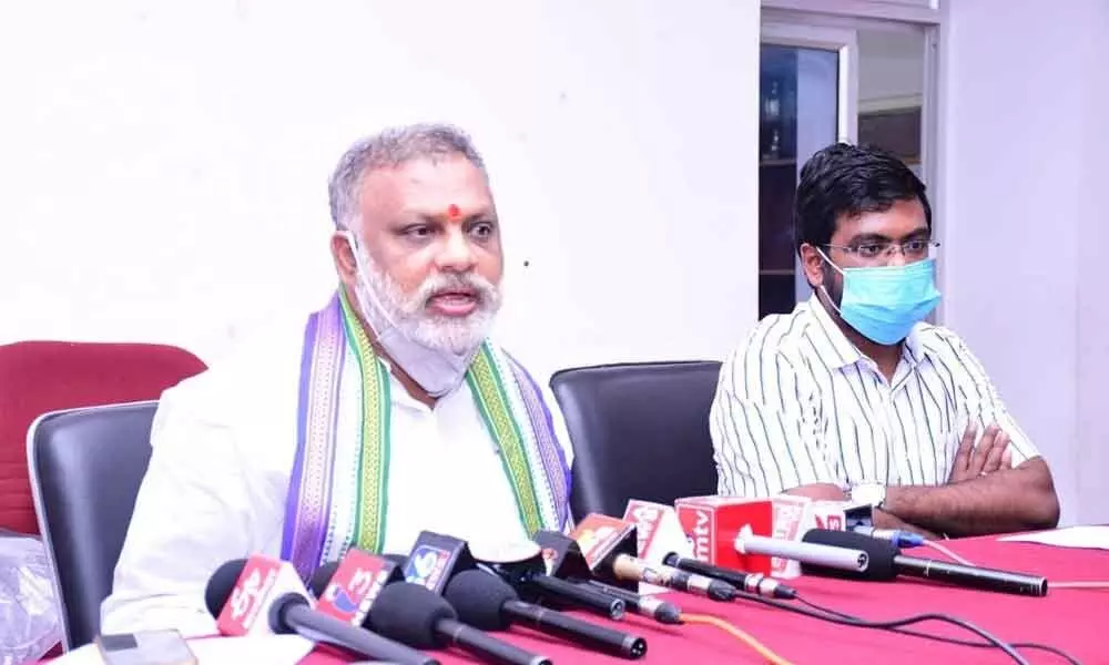 Mayor B Y Ramaiah addressing media conference at Conference Hall in Kurnool on Thursday. Commissioner D K Balaji is also seen