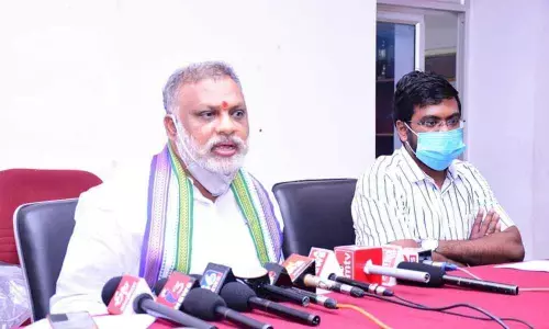 Mayor B Y Ramaiah addressing media conference at Conference Hall in Kurnool on Thursday. Commissioner D K Balaji is also seen