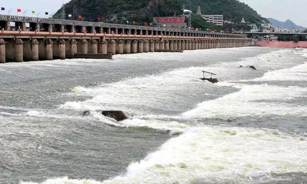 Floodwater gushing out from Prakasam Barrage in Vijayawada on Friday