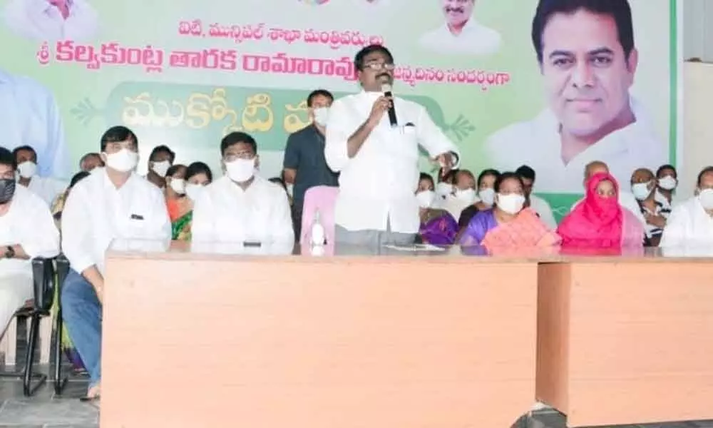 Minister Puvvada Ajay Kumar addressing a meeting of party leaders and workers in Khammam on Friday.