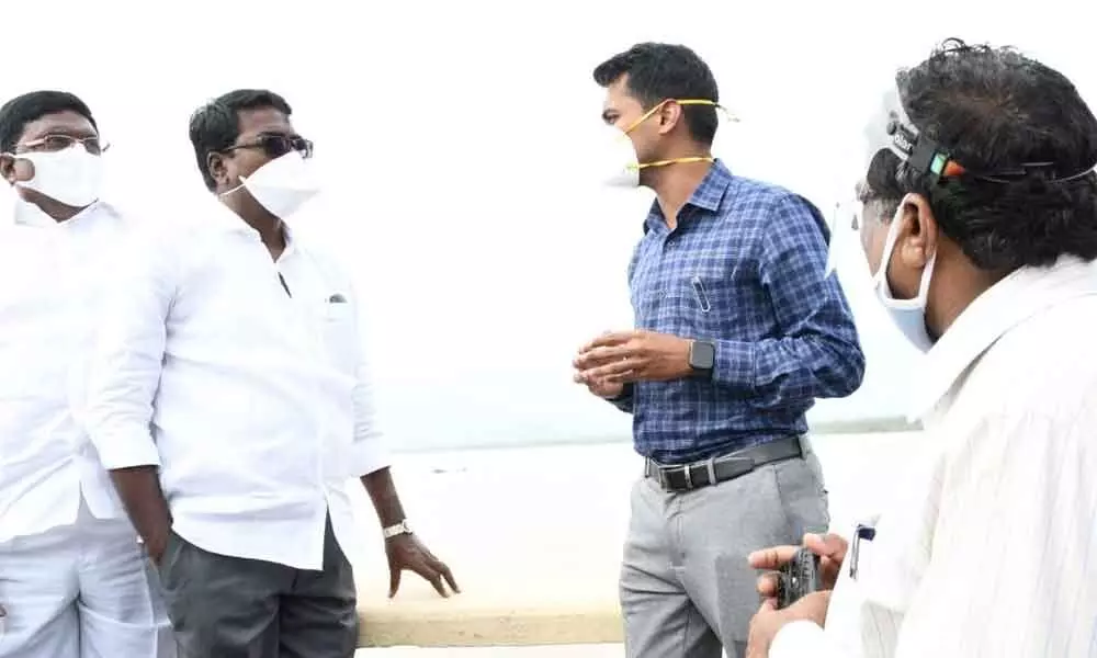 Minster Ajay and District Collector D Anudeep inspecting the flood situation at Godavari bridge in Bhadrachalam on Friday.