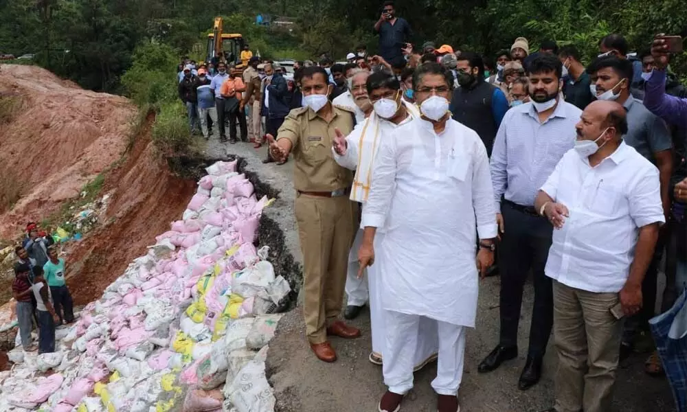 Revenue Minister Ashoka inspects a damaged road on Bengaluru-Mangaluru highway on Saturday