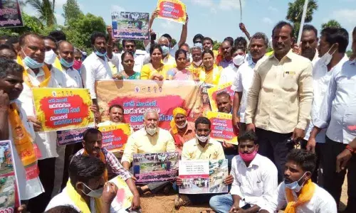 Staging a protesting against the lethargy of district officers  in laying roads and to attend the needs of public in Gudipala mandal