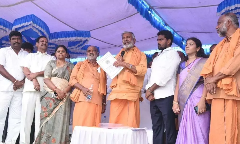 Minister for Panchayat Raj P Ramachandra Reddy addressing a meeting held in Palamaner on Sunday. Chittoor MP N Reddappa and others are also seen.
