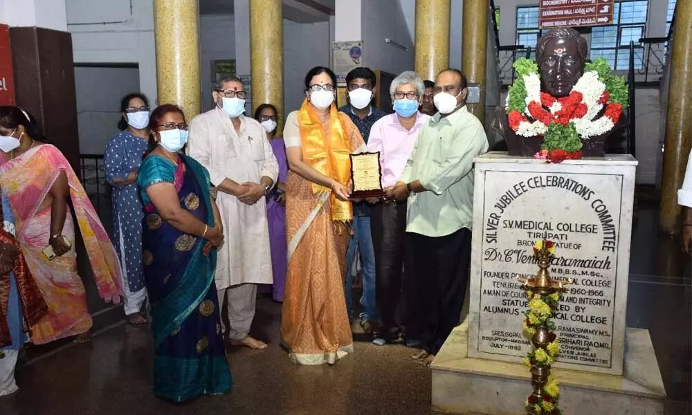 Dr GV Prakash and Dr Rayapu Ramesh Babu presenting a memento to SV Medical College Principal Dr C Jaya Bhaskar in Tirupati on Sunday.