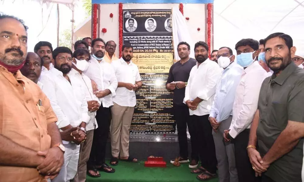 Ministers M Goutham Reddy and P Anil Kumar unveiling plaque for the construction works of Auto Nagar in Nellore on Sunday