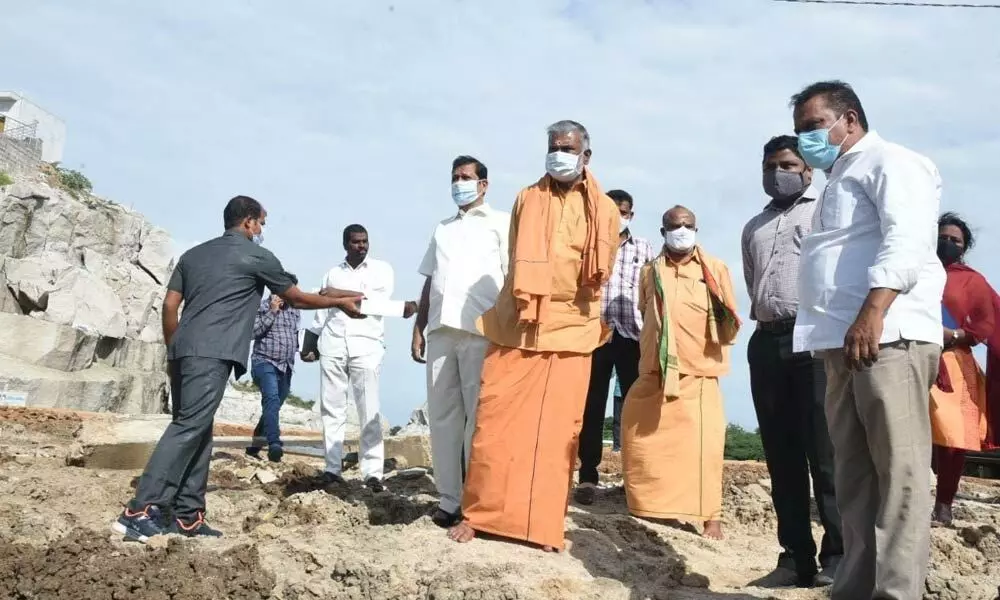 Minister Peddireddi Ramachandra Reddy during an inspection of the construction works at Vakulamatha temple atop Peruru Banda in Chittoor district on Sunday