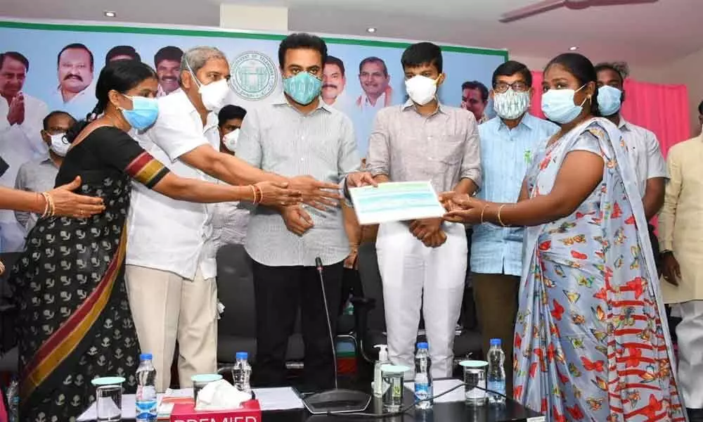 Minister KT Rama Rao launching distribution of ration cards in Sircilla on Monday