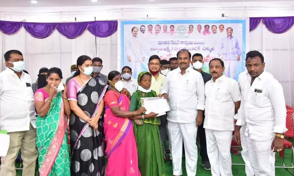 MLA Bandla Krishna Mohan, along with Gadwal Municipal Chairman BS Keshavulu, distributed the cards to the beneficiaries at a programme