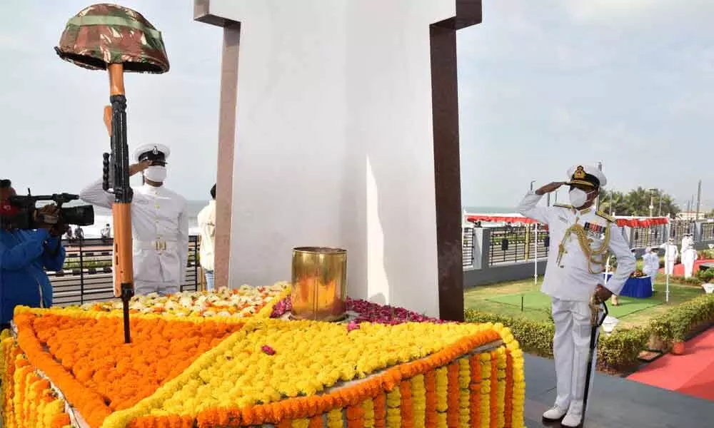 Marking the 22nd anniversary of Kargil Vjay Diwas, Vice Admiral Sreekumar Nair paying homage to the brave soldiers who laid down their lives during the Kargil War at the Victory at Sea War Memorial  in Visakhapatnam  on Monday