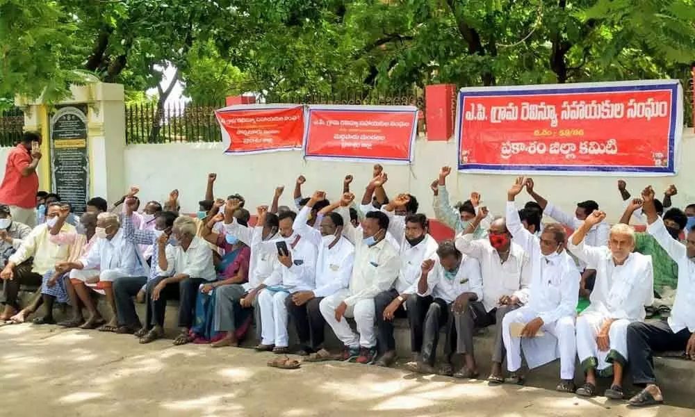 VRAs from the Prakasam district protesting in front of the Collectorate in Ongole on Monday