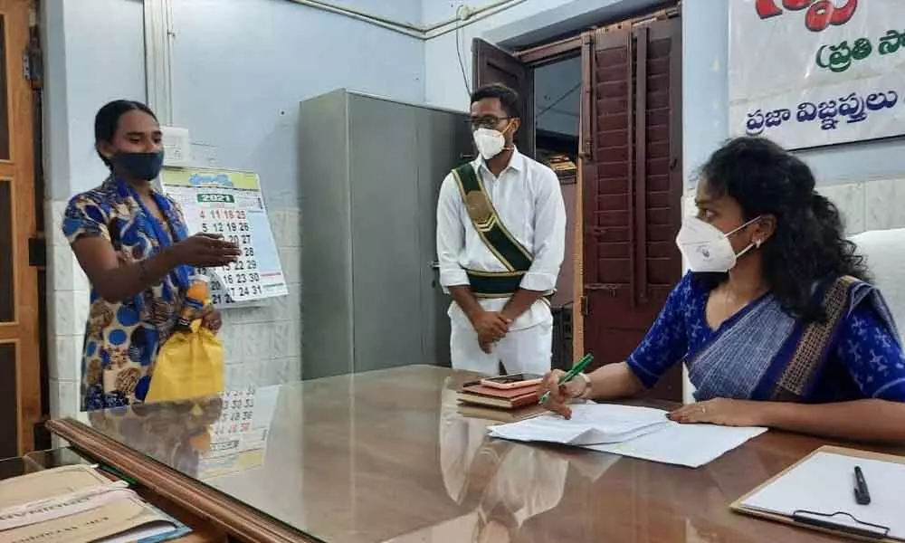 Sub-Collector Jahnavi receiving petition from a woman at her office in Madanapalli on Monday