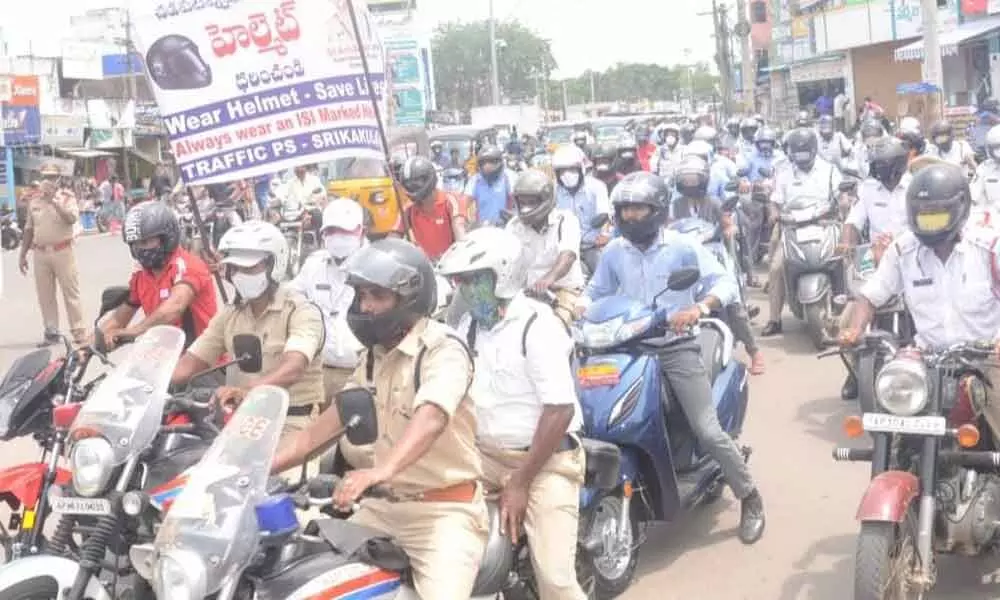 Traffic police taking part in a bike rally in Srikakulam on Monday