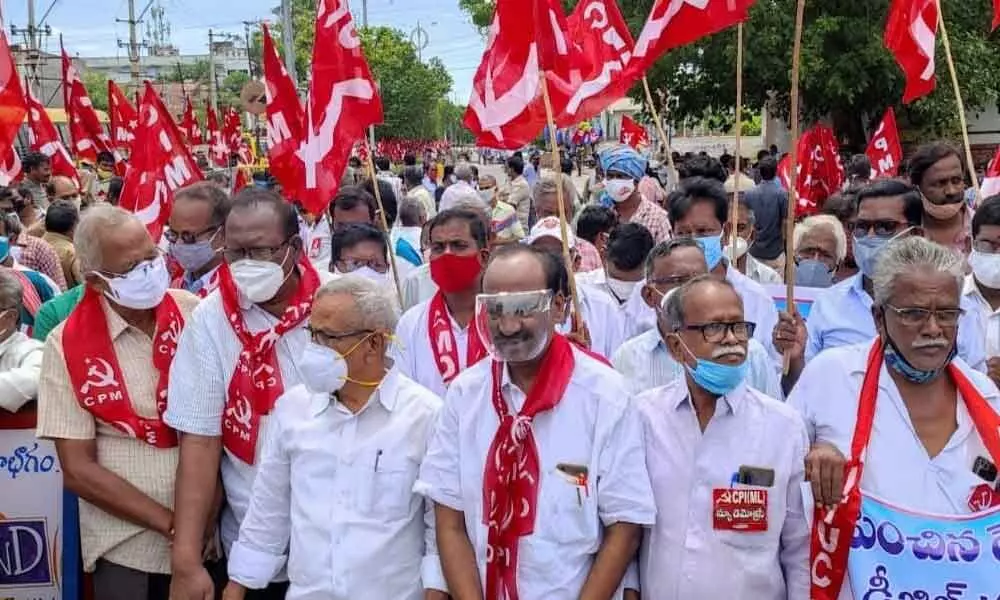 Left parties leaders staging protest against fuel price hike in Vijayawada on Monday