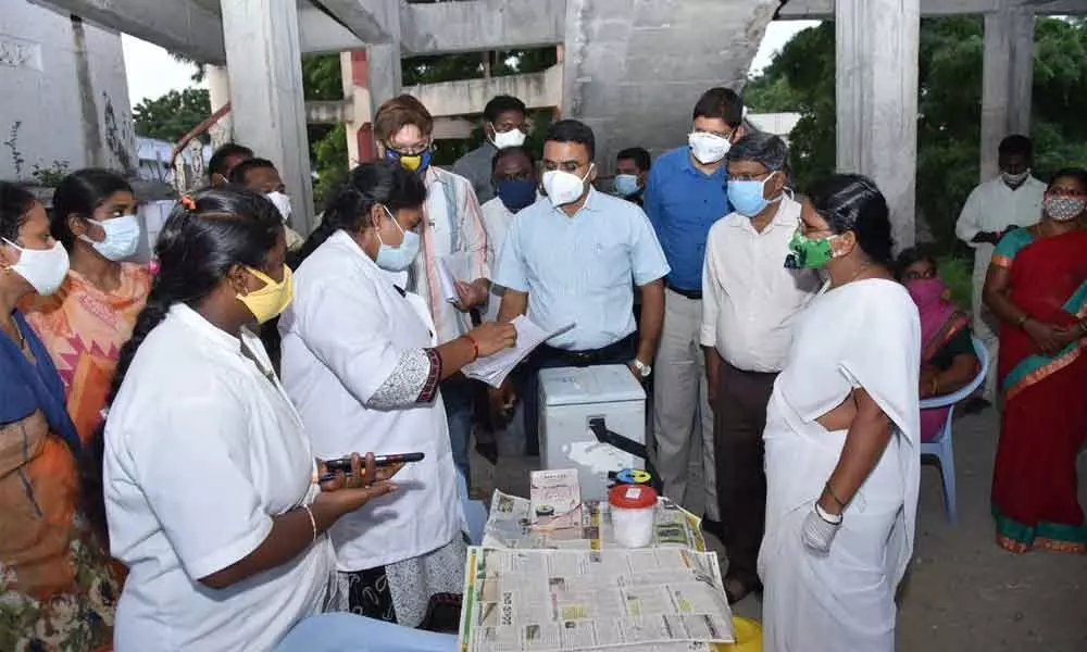 District Collector Vivek Yadav visiting a vaccination centre set up at village secretariat at Takkellapadu in Guntur district on Monday