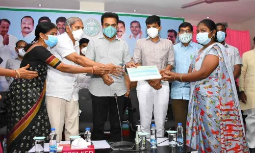 Minister KT Rama Rao launching distribution of ration cards in Sircilla on Monday