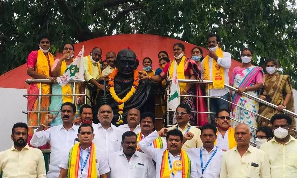 TDP corporators staging a protest at Gandhi statue in Visakhapatnam on Tuesday