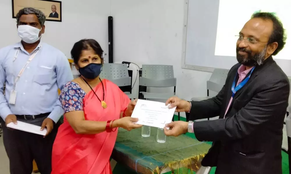 Bank officials providing loan approval documents to women entrepreneurs in Nizamabad on Tuesday